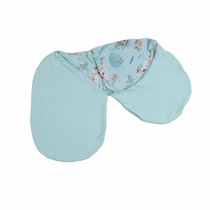 Reversible newborn baby cocoon swaddle featuring World Traveler design Silky Modal fabric.