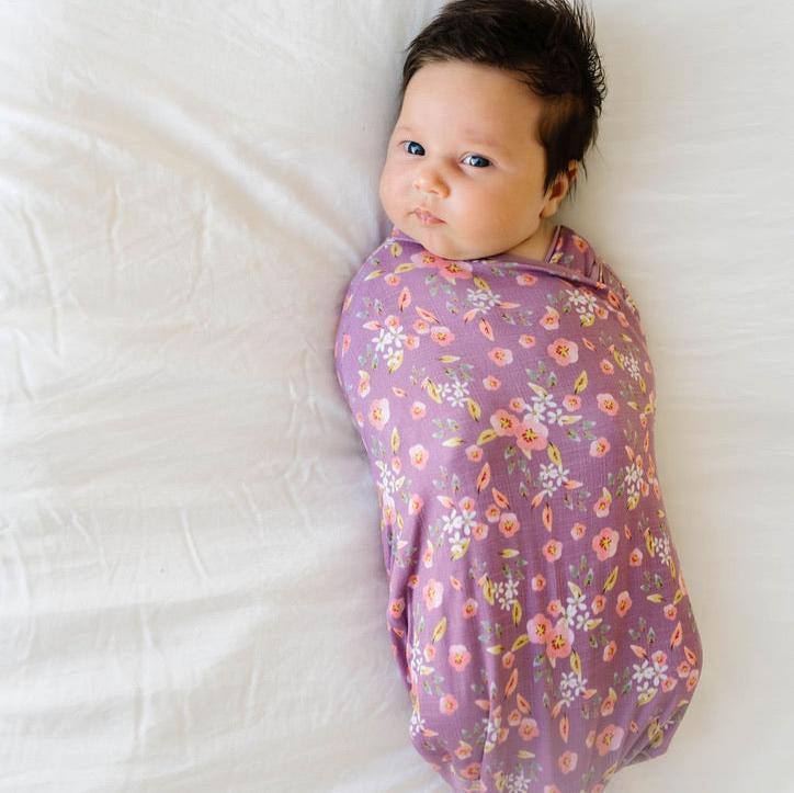 Soft baby cocoon swaddle made from Silky Modal in Peachy Lilac design.