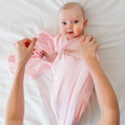 Soft Baby Pink Gingham design on a Cocoon swaddle blanket in Silky Modal fabric styles.