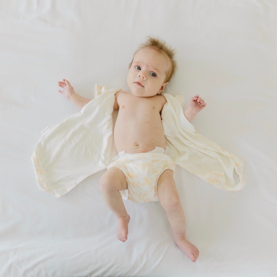 Bitty Blooms design flutter sleeve winged bodysuit for babies in silky modal fabric.