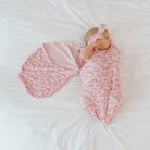 Soft Bitty Pink Blooms design enhances this Cocoon swaddle baby blanket in Silky Modal fabric styles.
