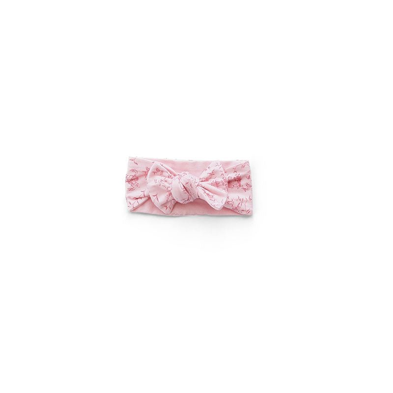 Whimsical garden design baby headwrap with bow made from breathable bamboo and organic cotton fabric.