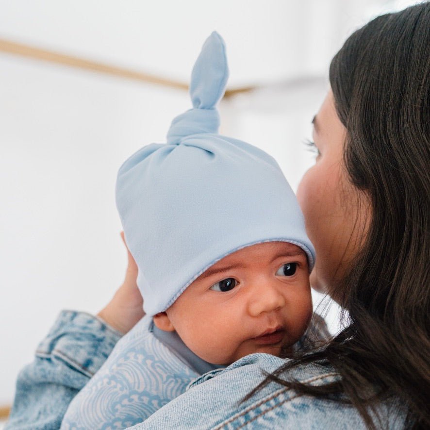 Reversible Blue Swells baby beanie made from classic brushed fabric for a soft cozy fit.