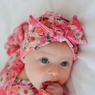 Cozy ruched beanie with bow for babies featuring the gentle Flower Power print.