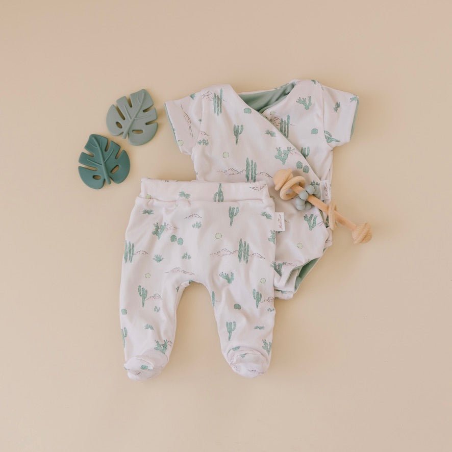 Short-sleeve winged bodysuit featuring the Desert Sunsets print in cozy classic brushed fabric.