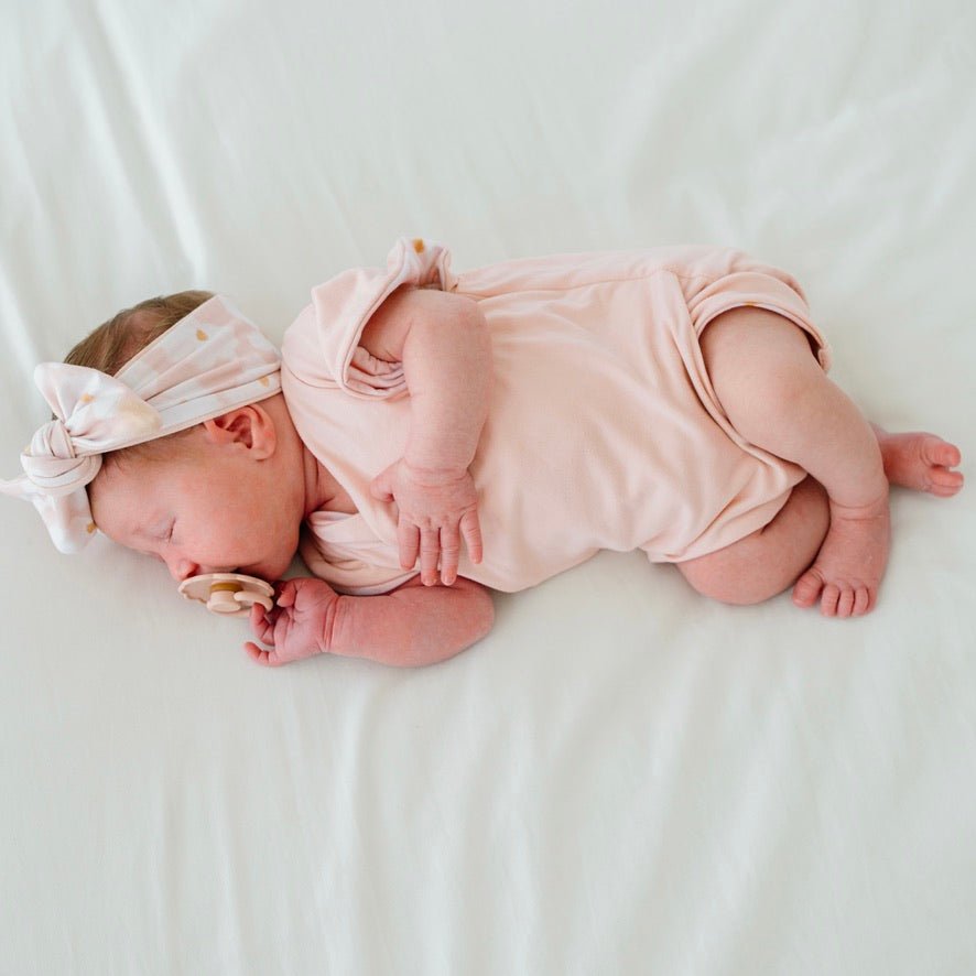 Reversible floral Sweet Lily short-sleeve bodysuit for baby in Classic Brushed fabric styles for everyday wear.