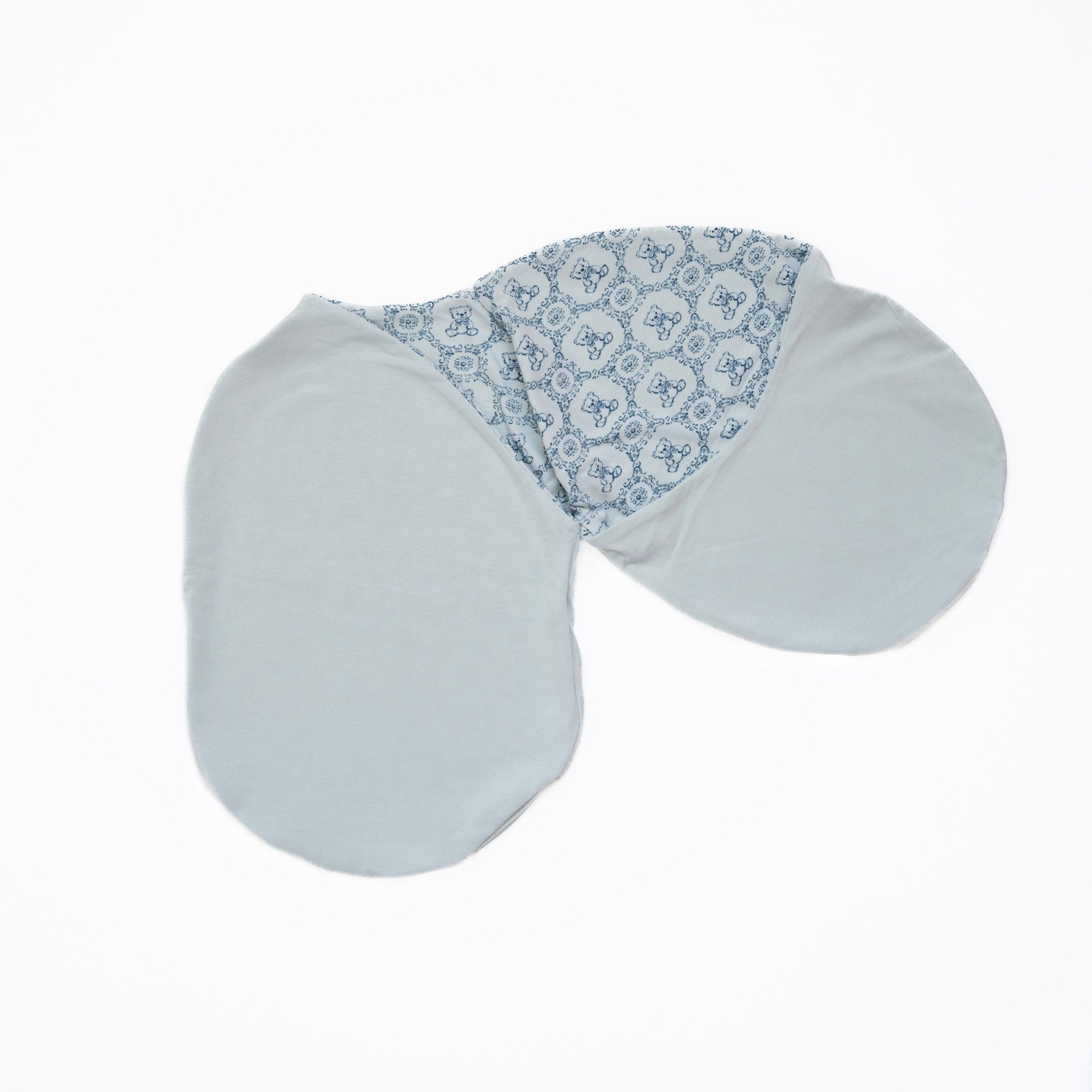 Teddy Tiles baby swaddle cocoon blanket in bamboo cotton fabric.