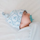 Reversible bamboo cotton baby knotty beanie in teddy tiles design.