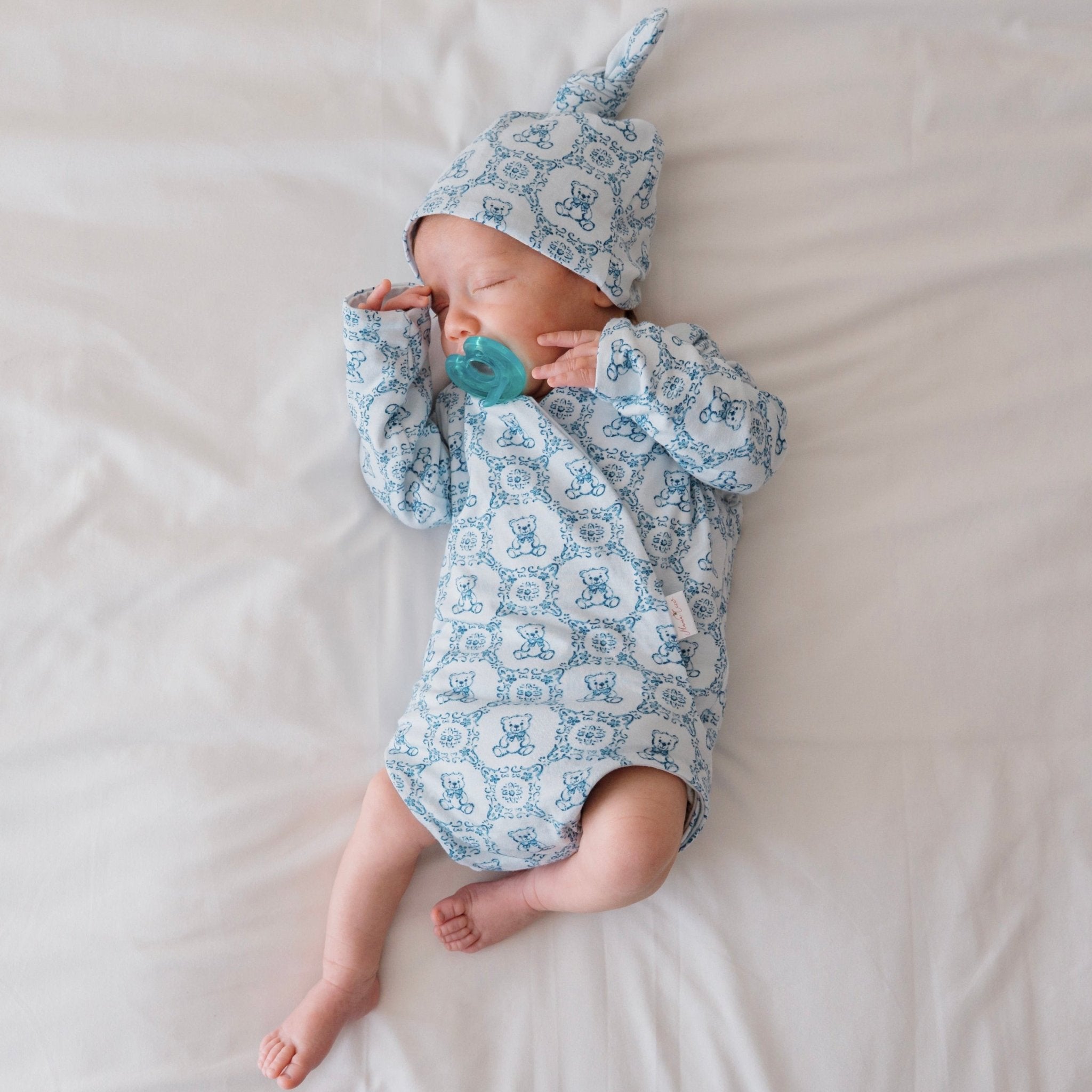 Teddy tiles newborn baby clothing bundle in classic brushed fabric with long sleeve ruffle cuff detail.