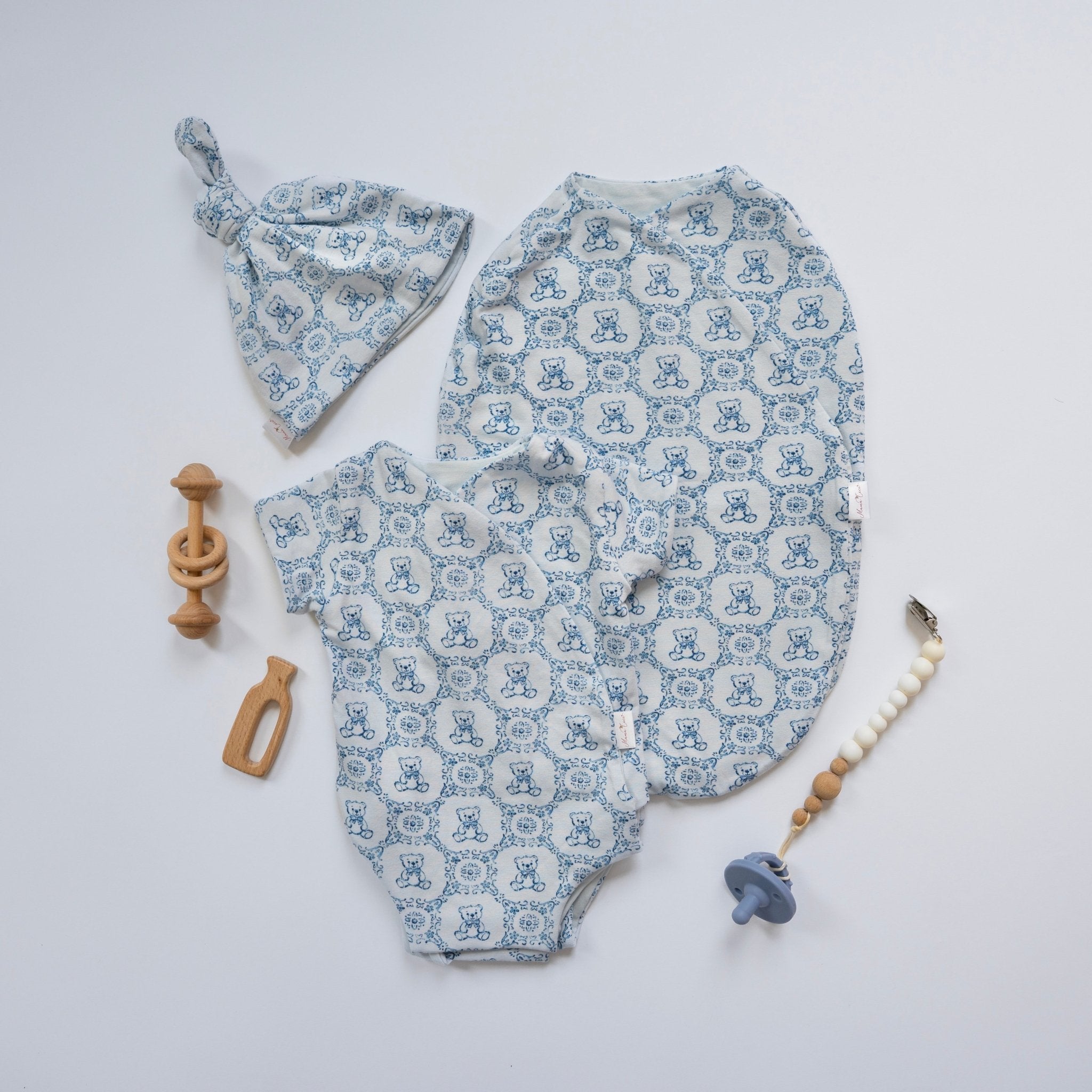 Newborn bundle with short sleeve essentials in bamboo cotton fabric with teddy tiles design.