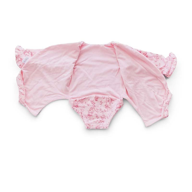 Reversible ruffle cuff long sleeve baby onesie made from bamboo cotton.