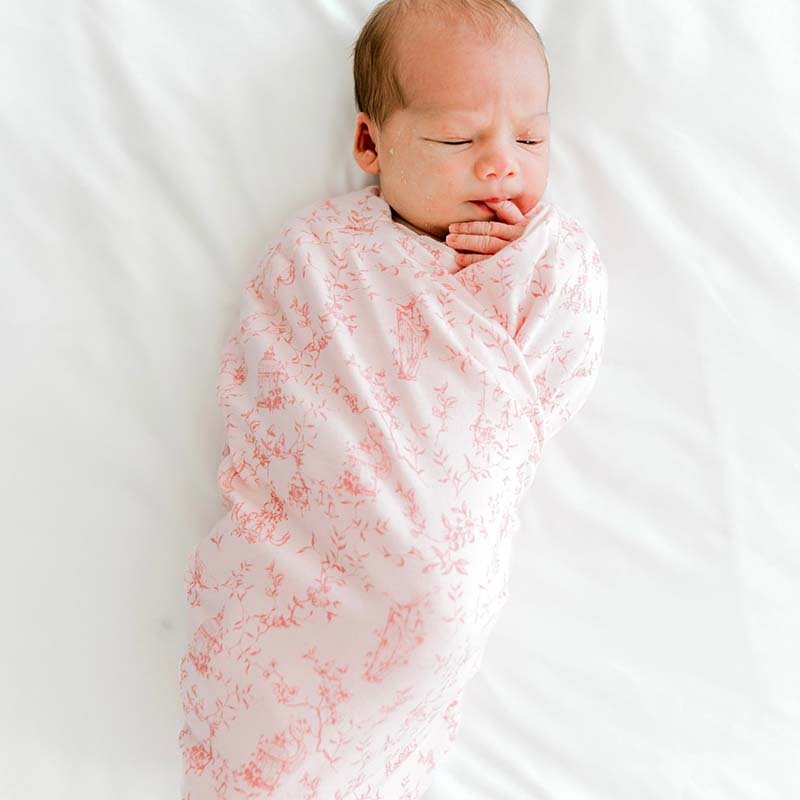 Organic cotton and bamboo baby swaddle cocoon blanket featuring a charming Whimsical Garden design.