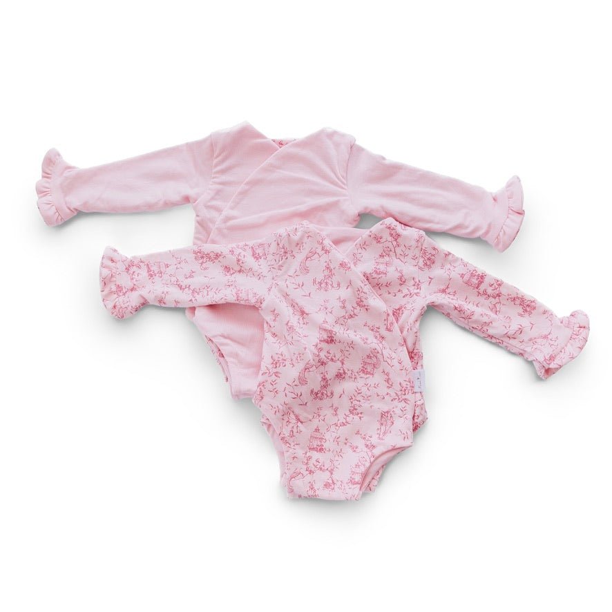 Reversible whimsical garden long sleeve ruffle cuff baby onesie.