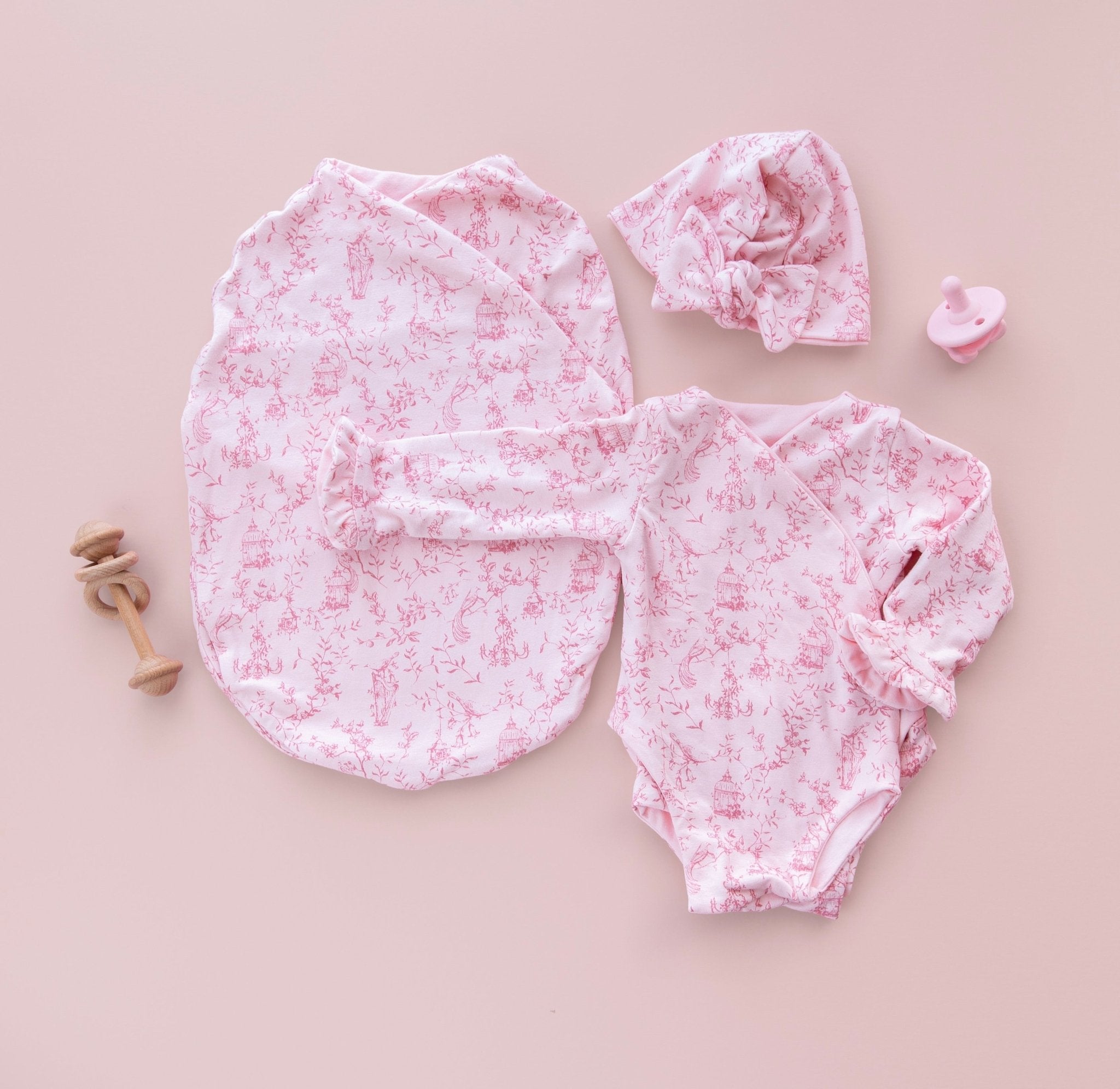 Bamboo Cotton newborn essentials bundle. Featuring cozy long sleeves and sweet ruffle cuffs in whimsical garden design.