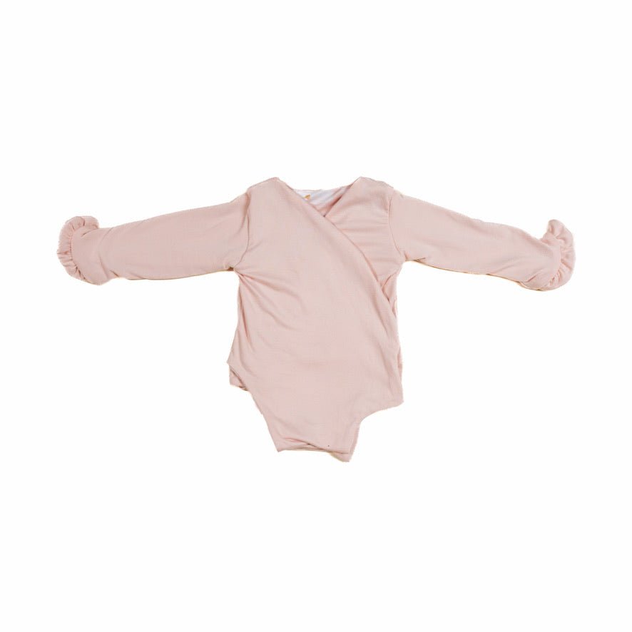 Baby long sleeve bodysuit in Sweet Lily design brushed fabric featuring reversible wings and ruffle cuffs.