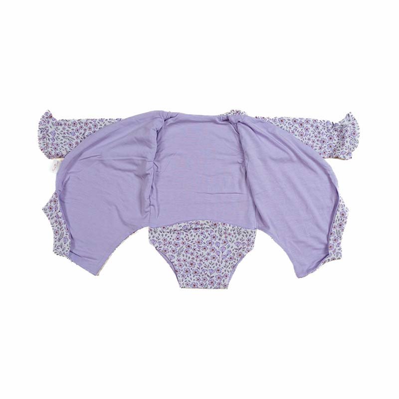Reversible long sleeved winged bodysuit for babies in silky modal fabric with ruffle cuffs.