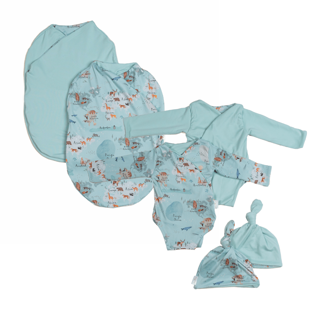 Newborn bundle with long sleeve essentials in classic brushed fabric with world traveler design.