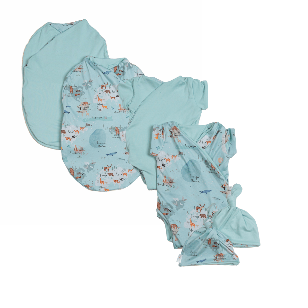 Newborn essentials bundle with short sleeves in classic brushed fabric with world traveler design.