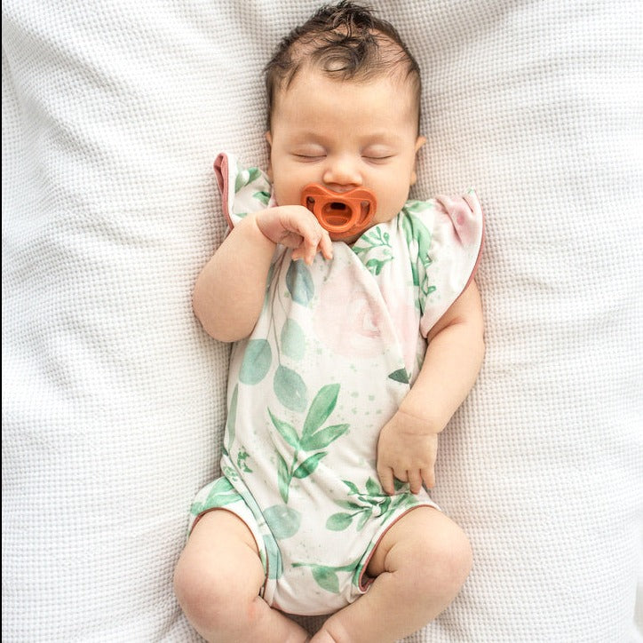 Blushing eucalyptus design flutter sleeve baby onesie and knotty beanie in classic brushed fabric.