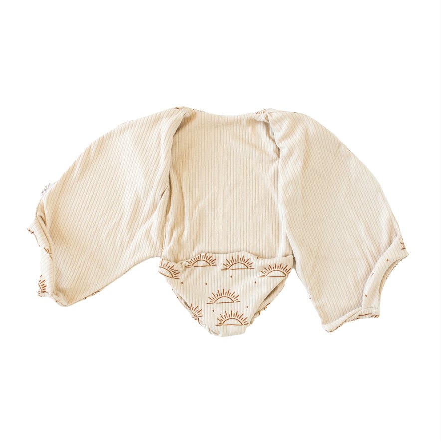 Classic brushed reversible short-sleeve winged bodysuit in Sandy Sunsets for a soft and stretchy outfit.