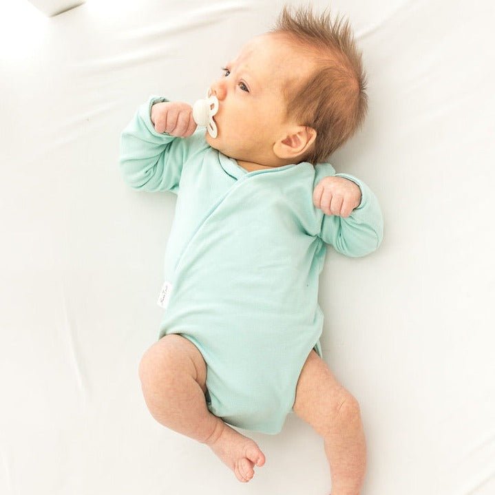 Honeydew Palms design winged bodysuit for babies in classic brushed fabric.