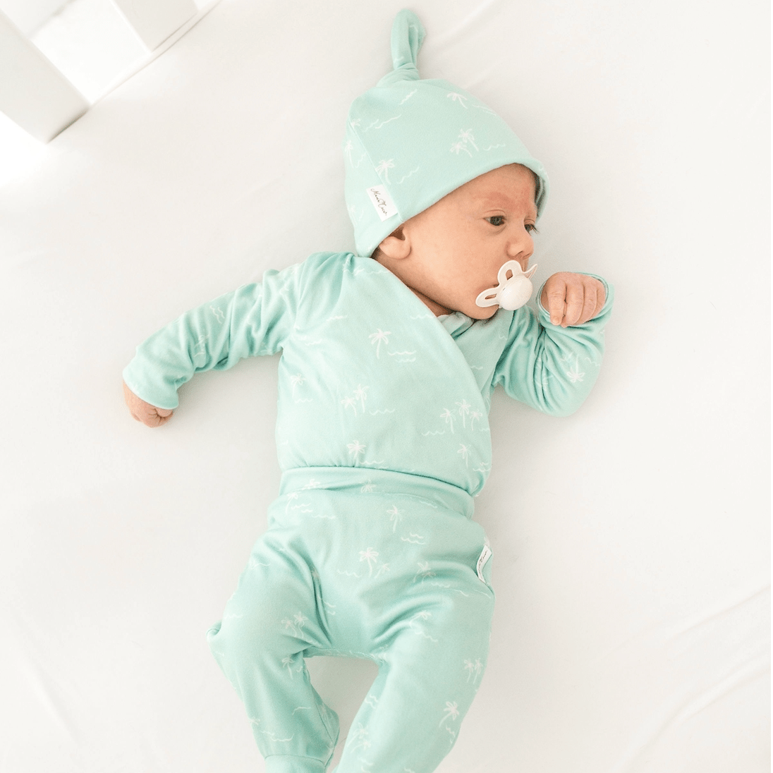 Cozy reversible baby beanie in Honeydew Palms with a gentle classic brushed fabric feel.