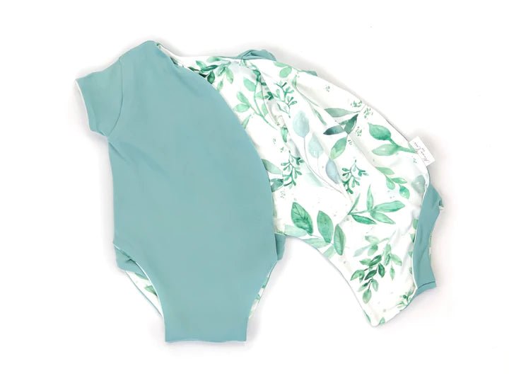 Lightweight reversible short-sleeve winged bodysuit in Saged Eucalyptus for soft everyday wear.