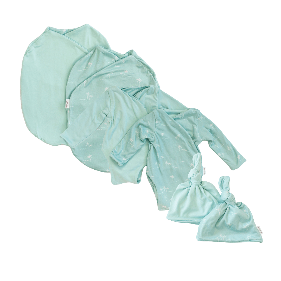 Newborn bundle with long sleeve essentials in classic brushed fabric with honeydew palms design.