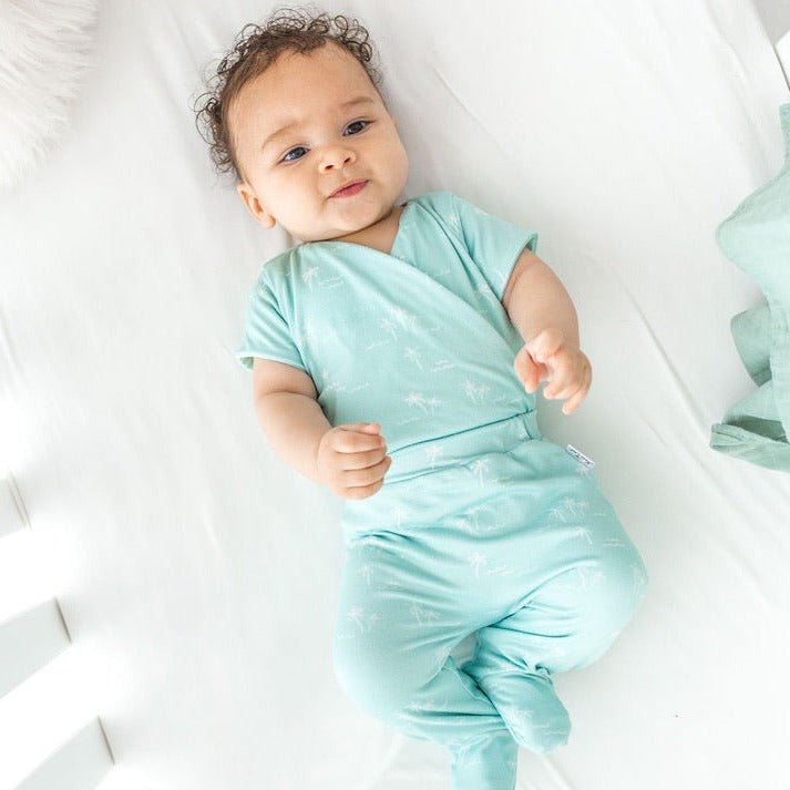 Honeydew palms design short-sleeve baby onesie and footie pants in classic brushed fabric.