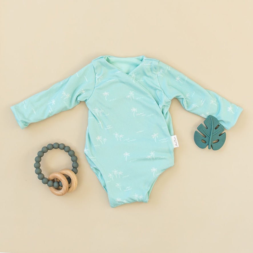 Honeydew Palms design long sleeve winged bodysuit in classic brushed fabric.