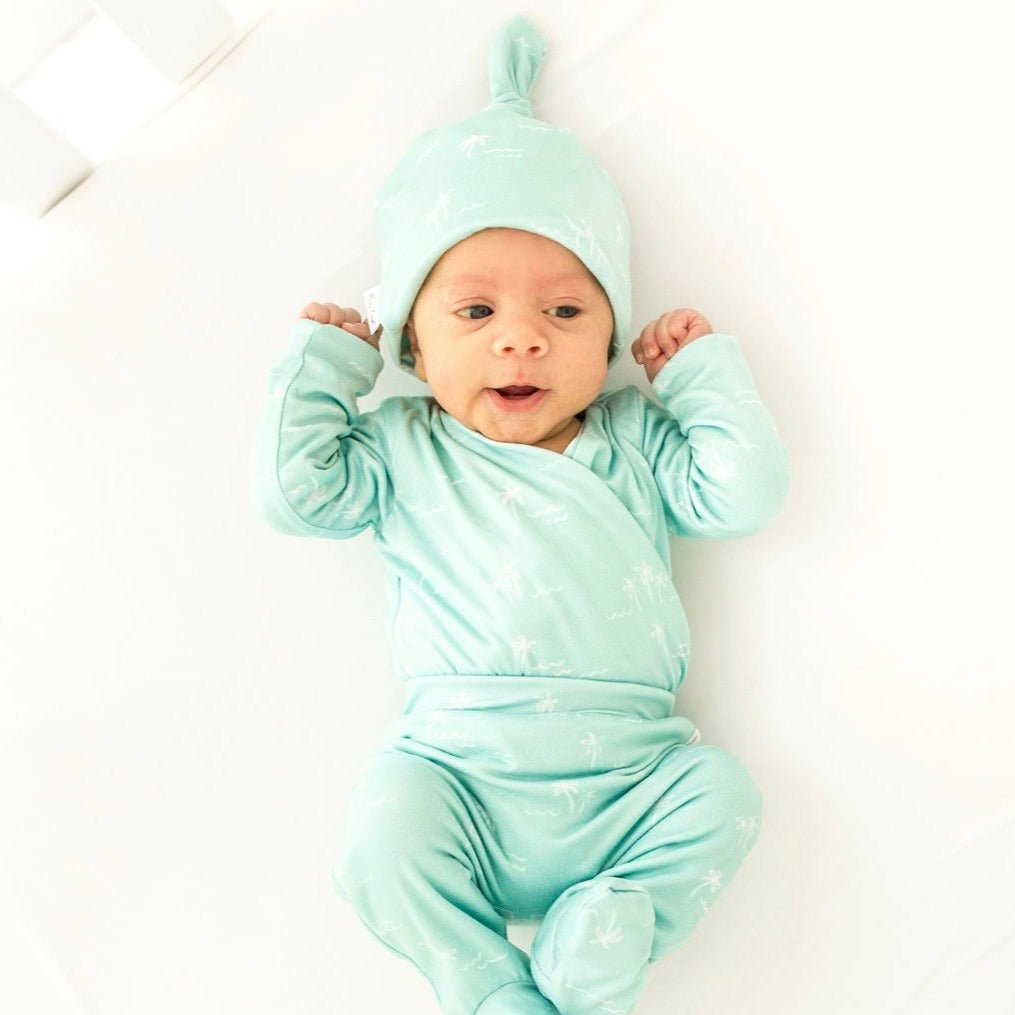 Honeydew Palms design baby winged bodysuit in classic brushed fabric.