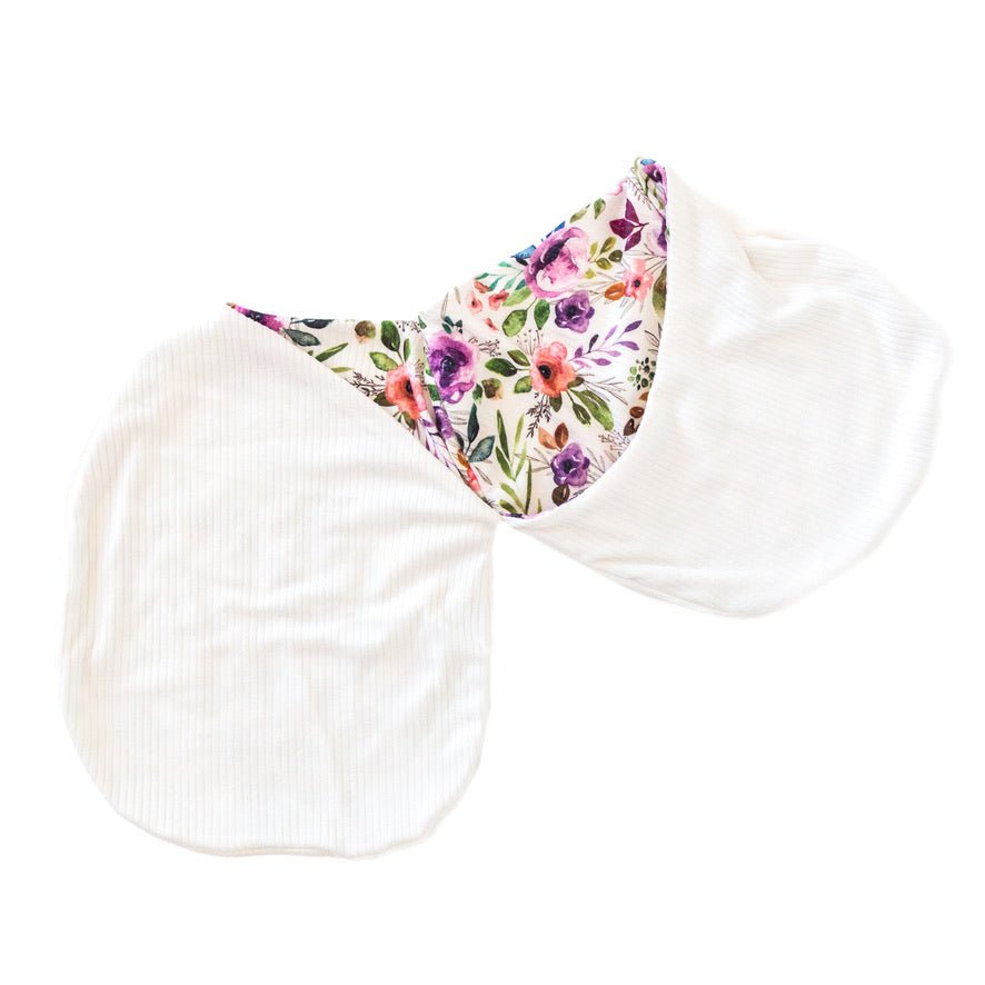 Silky Modal newborn baby cocoon swaddle with sweet Ivory Wildflowers pattern.