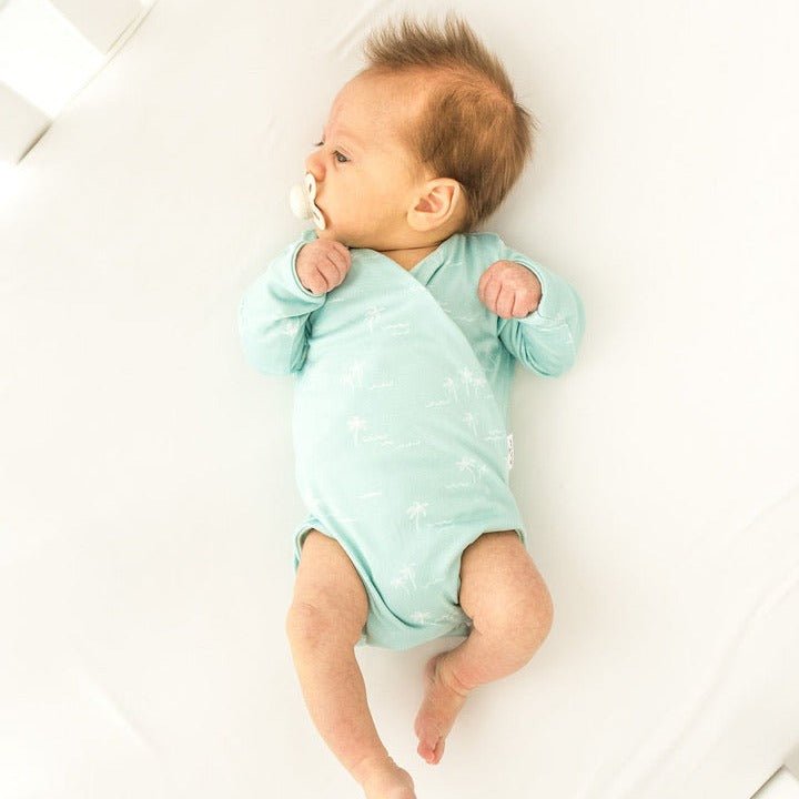 Honeydew Palms design long sleeve winged bodysuit.
