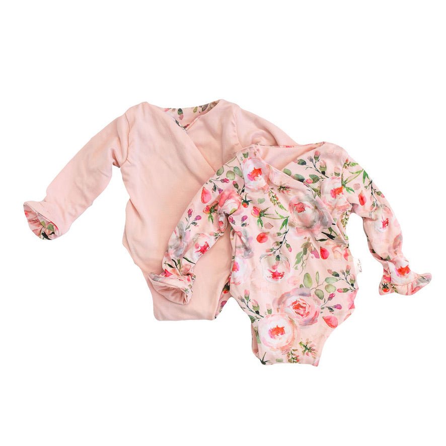 Reversible peachy rose fields long sleeve ruffle cuff baby onesie.