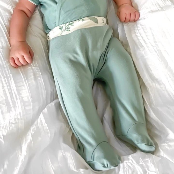 Reversible footie pants in saged eucalyptus design.
