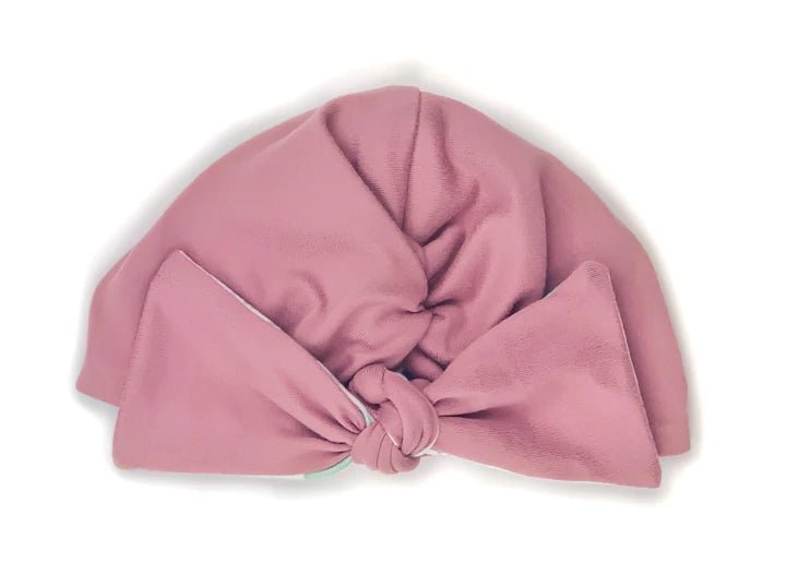 Comfortable reversible Blushing Eucalyptus ruched baby beanie with bow crafted from classic brushed baby fabric.