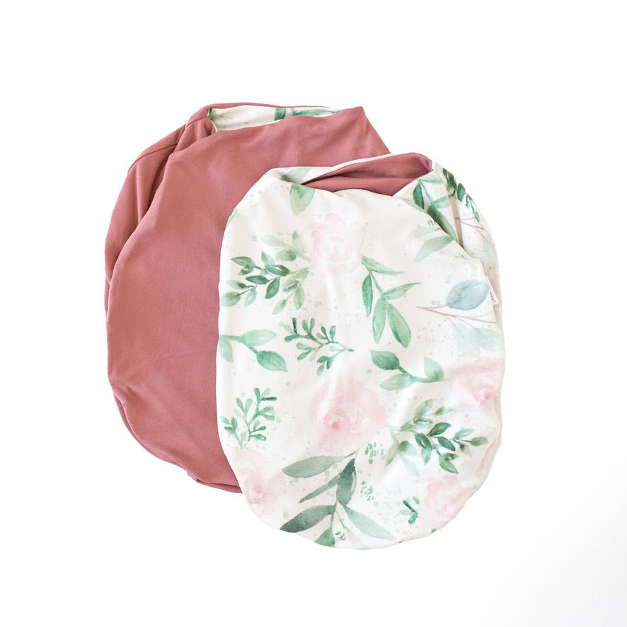 Reversible blushing eucalyptus design cocoon baby swaddle in classic brushed fabric.