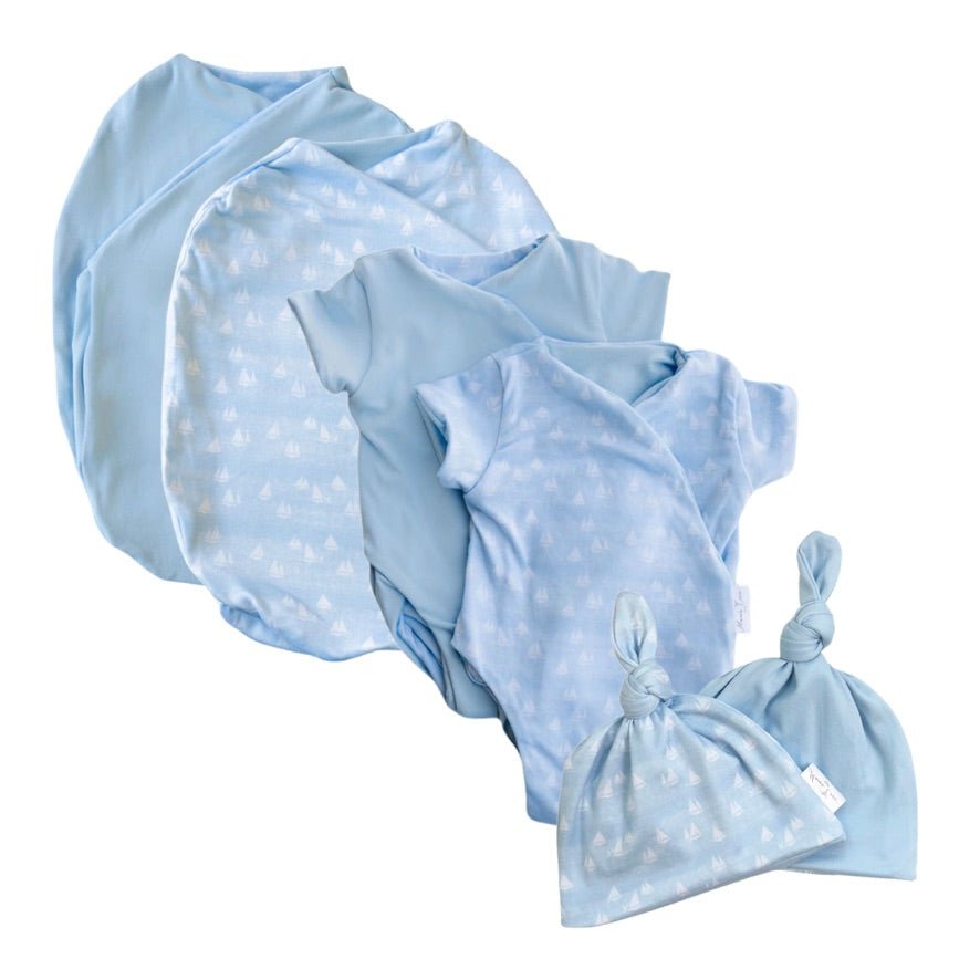 Newborn essentials bundle with short sleeves in classic brushed fabric with sailboat shores design.