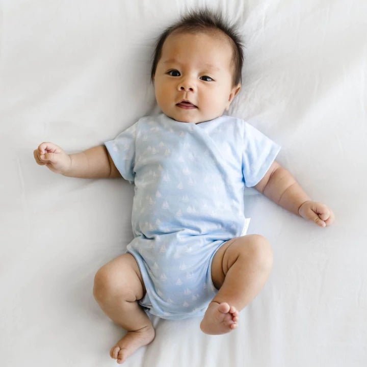 Short-sleeve winged bodysuit in sailboat shores design.