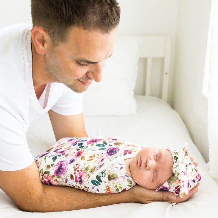 Soft baby cocoon swaddle made from Silky Modal in the Ivory Wildflowers design.
