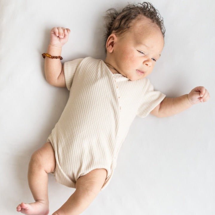 Reversible short-sleeve winged bodysuit featuring the Sandy Sunsets print in cozy classic brushed fabric.
