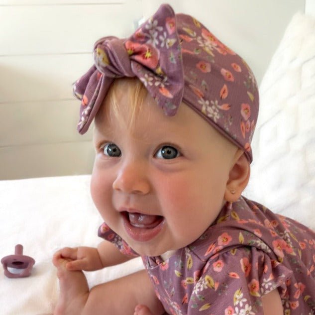 Cozy ruched beanie with bow for babies featuring the gentle Peachy Lilac print.
