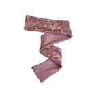 Sweet headwrap with bow, made from ultra-soft Peachy Lilac fabric.