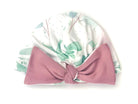 Soft ruched baby beanie with bow made from classic brushed fabric in the Blushing Eucalyptus design.