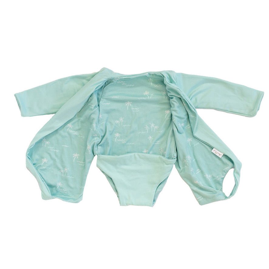 Long sleeved reversible winged bodysuit for babies in classic brushed fabric.
