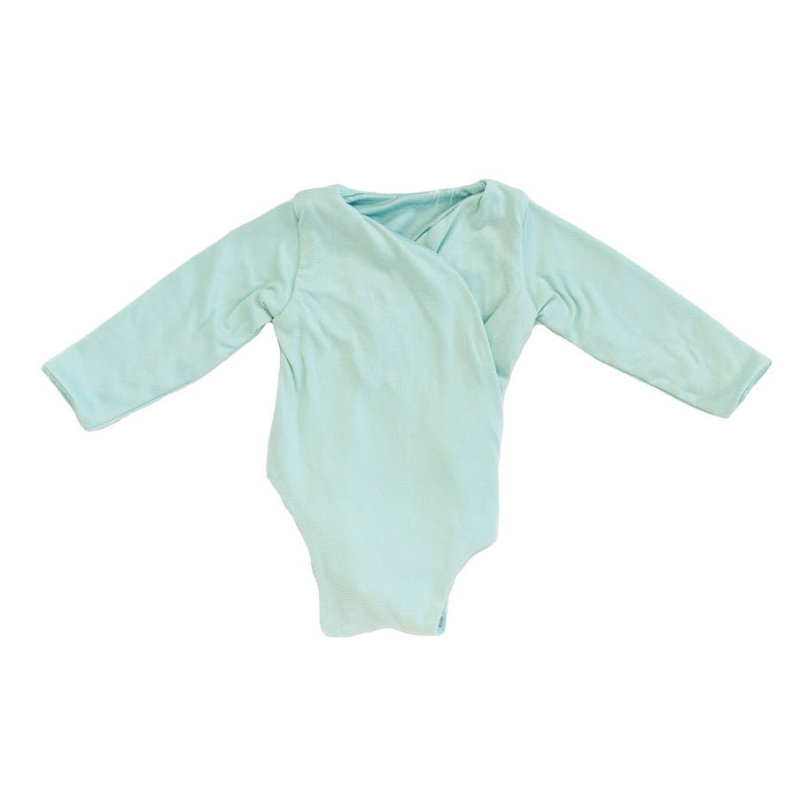 Reversible Honeydew Palms design long sleeved winged bodysuit in classic brushed fabric.